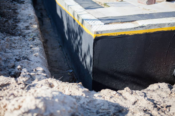 Professional Waterproofing technician working in Midway, KY